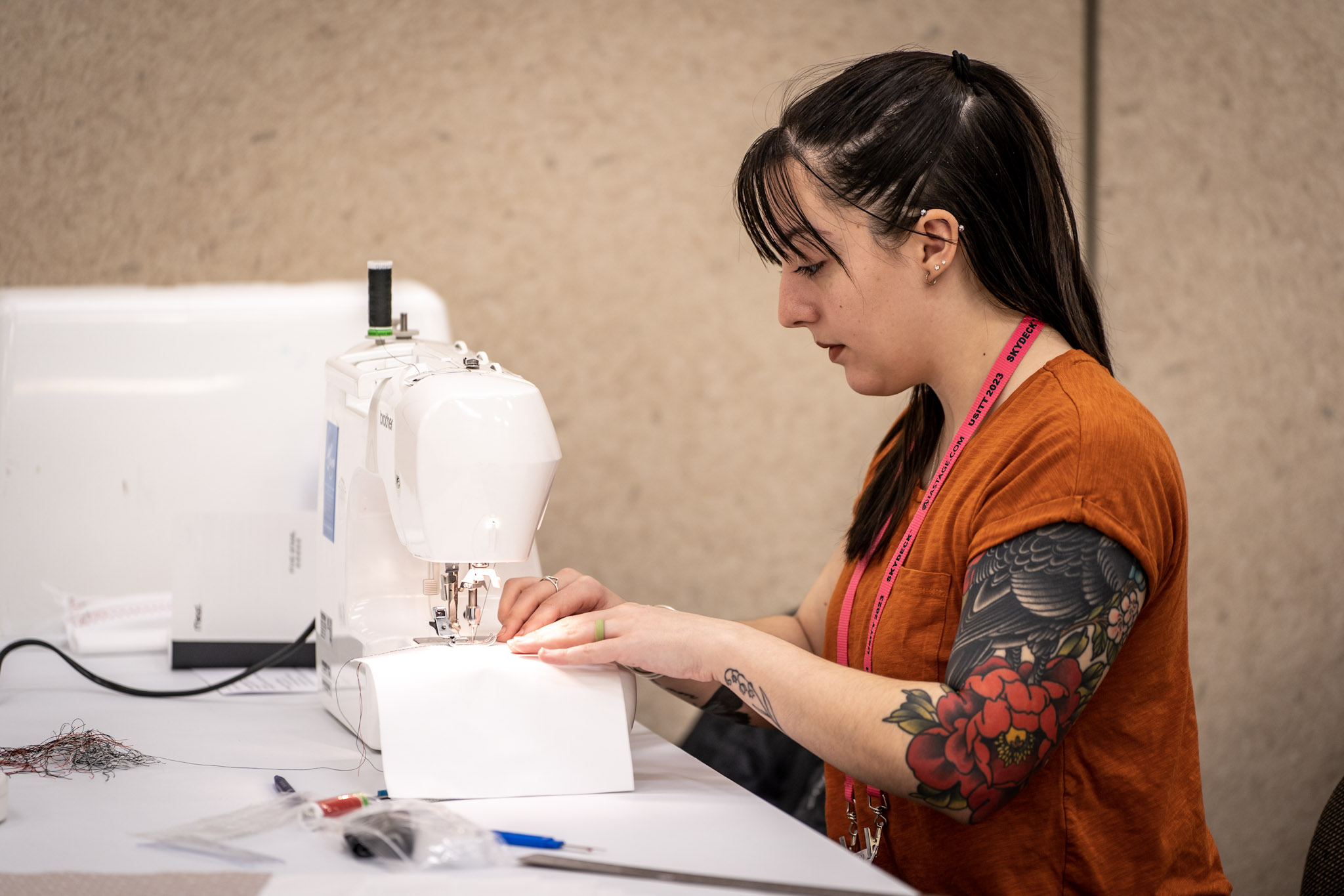 an attendee works on a sewing project