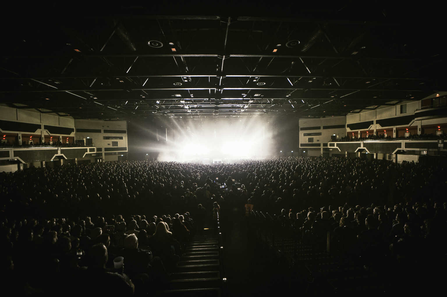 ChamSys Powers Show for Those Damn Crows Arena Debut. Band on stage performing.