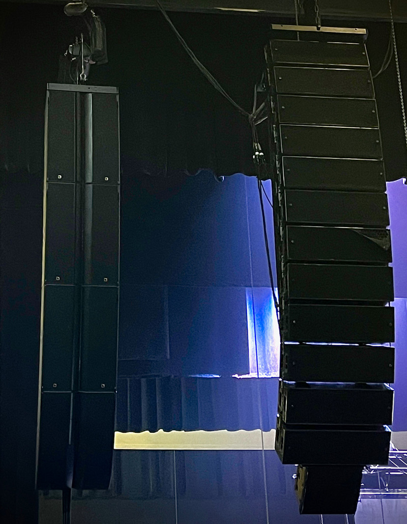 One of the tour’s L Series arrays shown hanging adjacent to a V-DOSC array permanently installed at the Texas Trust CU Theatre in Grand Prairie