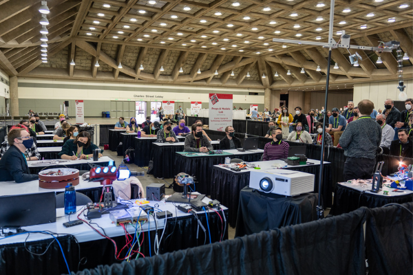 people participating in a lab on the expo floor in the lab space