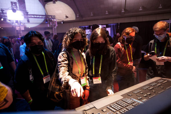 Individuals exploring new technology on the Expo floor