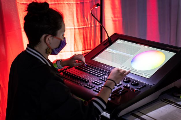 a person using a light board on the expo floor