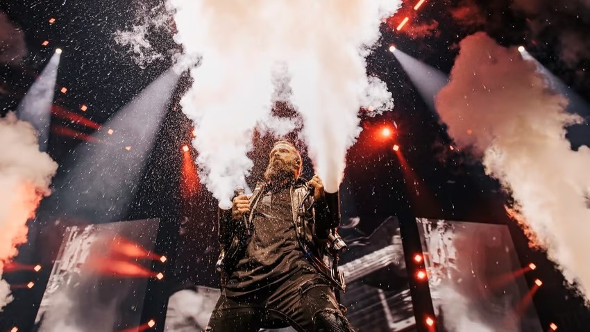 A performer shoots fog on stage at Winter Jam 2025.