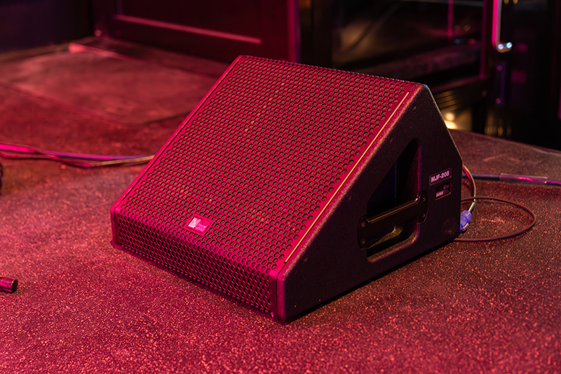 A speaker sits on the stage at Garcia's.