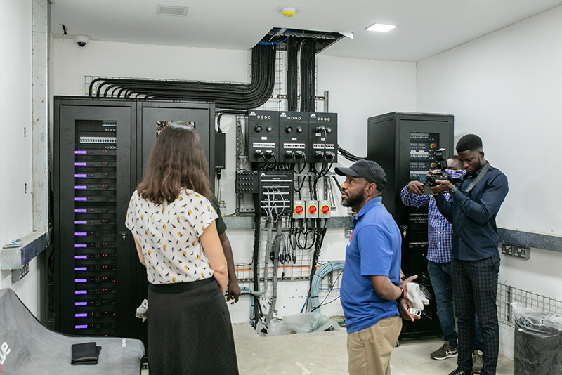 People looking at new audio system by martin in Ghana